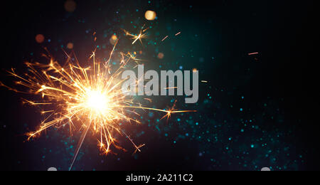 Sparkler on abstract background Stock Photo