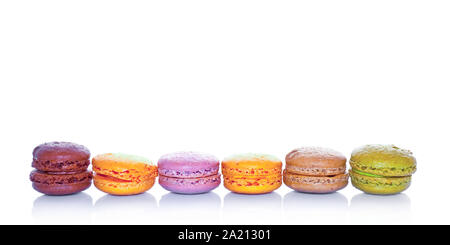 Row of pastel colored french macarons, on white background Stock Photo