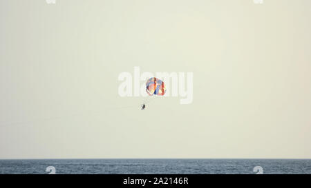 Towed parachute against blue sy on summer day. Stock Photo