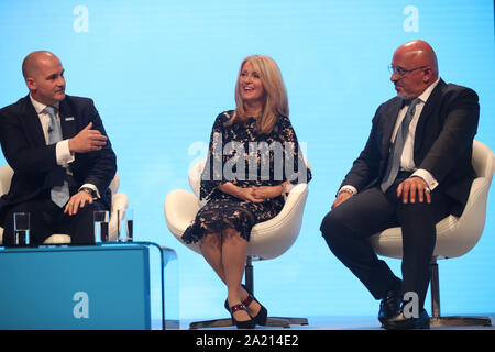 (Left to right) Northern Powerhouse minister Jake Berry, Minister of State for Housing Esther McVey and Parliamentary Under-Secretary for the Department of Business, Energy and Industrial Strategy Nadhim Zahawi at the Conservative Party Conference at the Manchester Convention Centre. Stock Photo