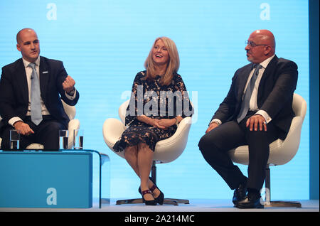 (Left to right) Northern Powerhouse minister Jake Berry, Minister of State for Housing Esther McVey and Parliamentary Under-Secretary for the Department of Business, Energy and Industrial Strategy Nadhim Zahawi at the Conservative Party Conference at the Manchester Convention Centre. Stock Photo