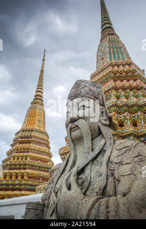 Chinese Guard statue in Wat Pho Buddhist temple, Bangkok, Thailand Stock Photo