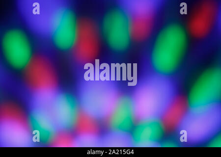 Colorful lights, backgrounds. Abstract festive blurred bokeh. Defocused backdrop with night light. Illuminated blur pattern. Stock Photo