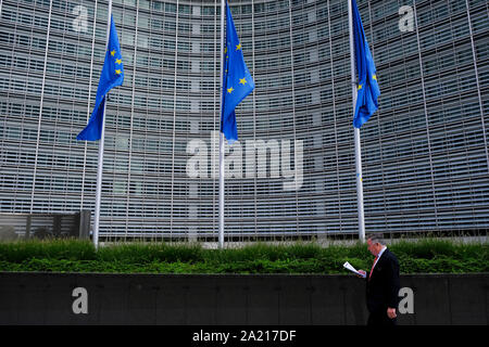 Brussels, Belgium. 30th Oct. 2019.  The European Union flags fly at half-mast as a tribute to former French President Jacques Chirac in front of the European Commission building. Stock Photo