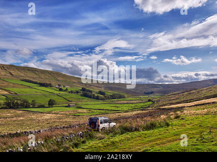 Car on unsurfaced road south of Hawes. Yorkshire Dales National Park, England. Stock Photo