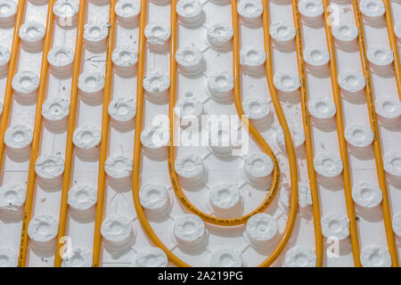 Laying a floor heating with installation panels in detail Stock Photo