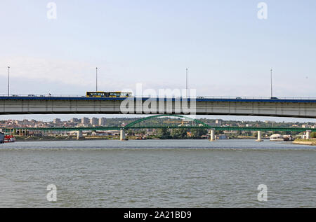 Bus on Branko's bridge seen over Zemunski Road bridge from a boat on Sava River, Belgrade, Serbia. Stock Photo