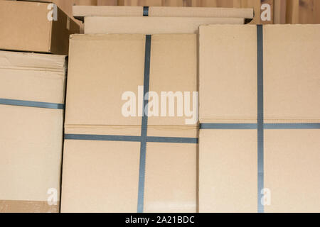 Stacked cardboard boxes in a warehouse Stock Photo
