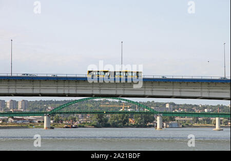 Bus on Branko's bridge seen over Zemunski Road bridge from a boat on Sava River, Belgrade, Serbia. Stock Photo