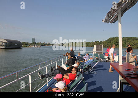 Interior view of the Danube River cruise boat, with the Kolos Sports and recreational centre on the left and the Veliko Ratno Ostrvo (Great War Island) to the right, Danube-Sava confluence, Belgrade, Serbia. Stock Photo