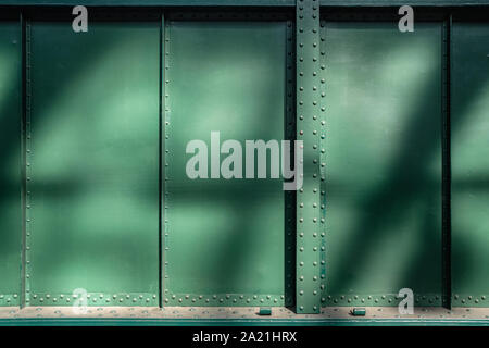 Abstract green metal textured background with rivets and bolts Stock Photo