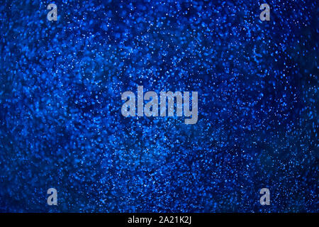 Dark blue water and small bubbles bokeh Stock Photo