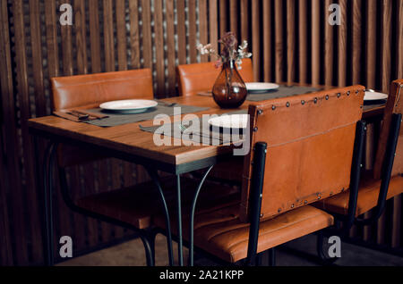 Cozy interior of a restaurant in Seville, Andalusia, Spain. Selective focus on foreground (fork) Stock Photo