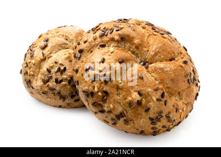 Two traditional whole wheat kaiser rolls with linseeds and sesame seeds isolated on white. Stock Photo