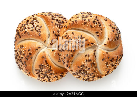 Two traditional white kaiser rolls with linseeds and sesame seeds isolated on white. Top view. Stock Photo