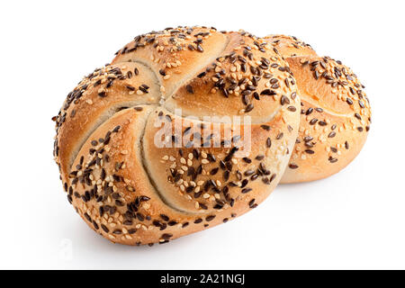 Two traditional white kaiser rolls with linseeds and sesame seeds isolated on white. Stock Photo
