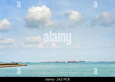 Industrial cargo shipping tankers in Singapore harbor Stock Photo