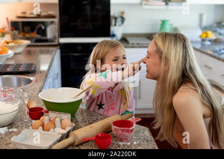 Family making Christmas cookies at home Stock Photo