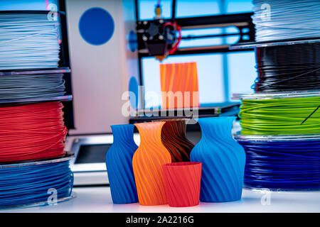 3D Printer Plastic filament for 3D printer and printed products in the interior of the design office Stock Photo