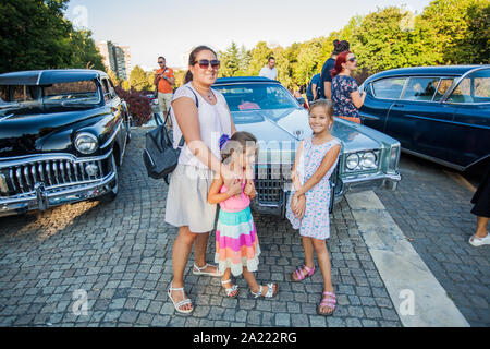 Family Portrait At Old Timer Exhibition Mother And Her Two Daughter At Old Car Show Stock Photo Alamy