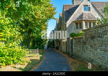 Traditional houses in a small medieval town of Burford in Cotswolds built of distinctive local yellow limestone, Oxfordshire, UK