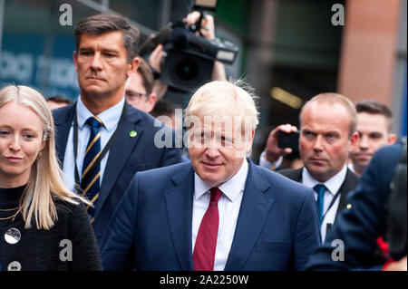 Manchester, UK. 30th September 2019. The Prime Minister, The Rt Hon Boris Johnson MP, leaves Day 2 of the 2019 Conservative Party Conference at Manchester Central. Credit: Paul Warburton/Alamy Live News Stock Photo