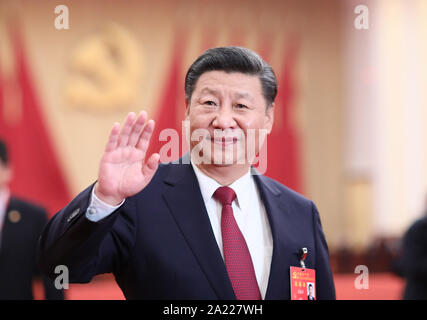 (190930) -- BEIJING, Sept. 30, 2019 (Xinhua) -- Xi Jinping meets with delegates, specially invited delegates and non-voting participants of the 19th Communist Party of China (CPC) National Congress at the Great Hall of the People in Beijing, capital of China, Oct. 25, 2017. TO GO WITH 'Xi Focus: Xi Jinping and China's new era' (Xinhua/Lan Hongguang) Stock Photo