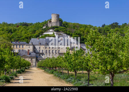 The tower of Chateau de La Roche-Guyon is perched atop the hill above the new chateau and garden Stock Photo