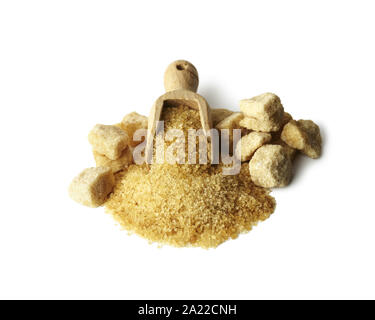 Brown cane sugar crystals and cubes in wooden scoop isolated on white background Stock Photo