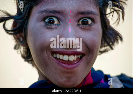 Portrait of surprised young Rajasthani girl with face painting Stock Photo