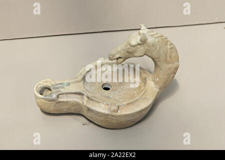 Ancient clay oil lamp, displayed at the National Archeological Museum Djerdap, Kladovo, Serbia. Stock Photo