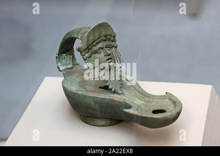 Ancient copper oil lamp, displayed at the National Archeological Museum Djerdap, Kladovo, Serbia. Stock Photo