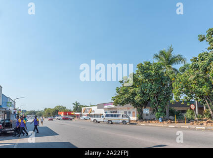 PHALABORWA, SOUTH AFRICA - MAY 18, 2019: A street scene, with businesses, vehicles and people, in Phalaborwa Stock Photo