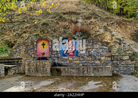 Fresh water gush from  fountain built from Christians  in the Balkan mountain near town Maglizh, Bulgaria Stock Photo