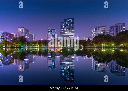 Bangkok night cityscape from the Lumpini park. Stock Photo