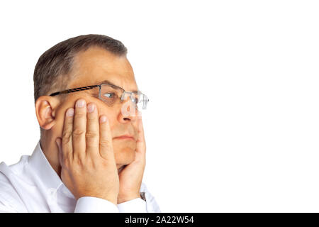 A man of age sits dreaming. On a white background. Stock Photo