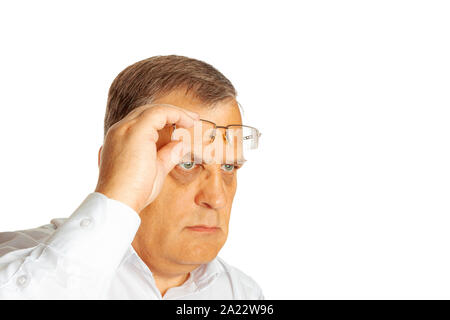 The man picked up his glasses and stared into the distance. Stock Photo