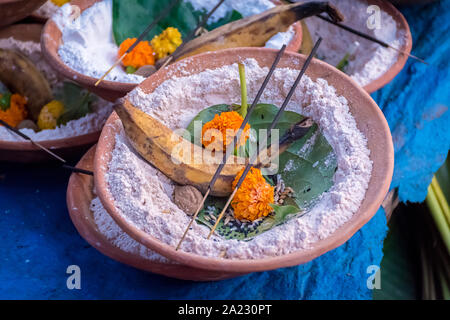 Soil malasa with rudraksha mala, Supari or betel nut, banana, pan pata or betel Leaf, banana Leaf, Red Thread (Kalava), agarbatti, flowers, sand decor Stock Photo