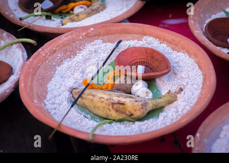 Soil malasa with rudraksha mala, Supari or betel nut, banana, pan pata or betel Leaf, banana Leaf, Red Thread (Kalava), agarbatti, flowers, sand decor Stock Photo