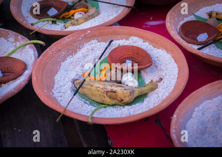 Soil malasa with rudraksha mala, Supari or betel nut, banana, pan pata or betel Leaf, banana Leaf, Red Thread (Kalava), agarbatti, flowers, sand decor Stock Photo