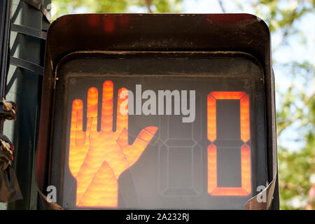 red hand stop sign with zero countdown timer pedestrian crossing crosswalk people signs chicago illinois united states of america Stock Photo