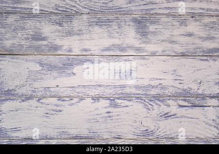 Wooden background texture. Creatively painted white and purple boards. Stock Photo