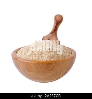 coconut flour in a bowl with wooden scoop isolated on white background Stock Photo