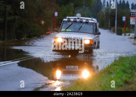 A Land Rover drives through a flooded section of Barnsdale Road between Allerton Bywater & Castleford Stock Photo