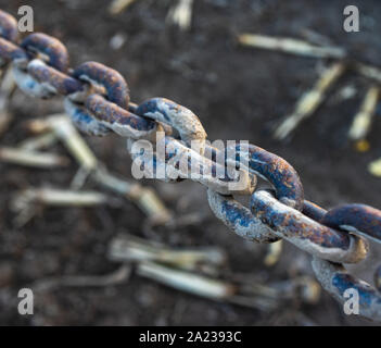 stained chain on dark background Stock Photo