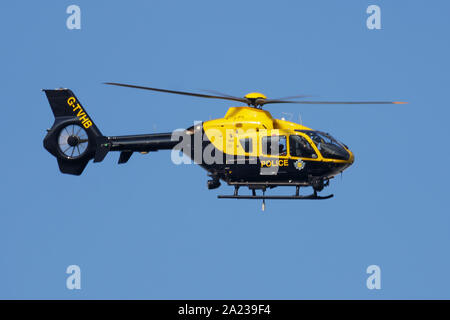 LONDON / UNITED KINGDOM - JULY 14, 2018: Metropolitan Police Eurocopter EC-135 helicopter flying at London Heathrow Airport Stock Photo