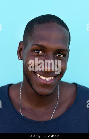 Portrait of an african man in front of a colorful wall Stock Photo