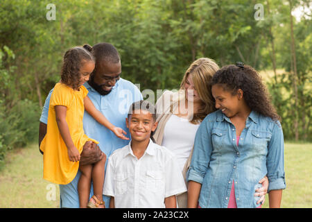 Portrait of a multi ethnic family laughing. Stock Photo