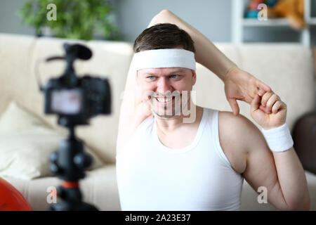 Man Vlogger Doing Exercise for Hands Portrait Stock Photo
