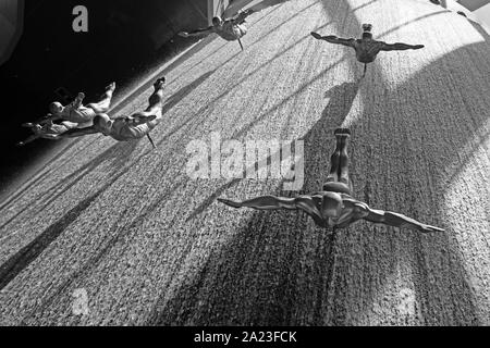 Waterfall with human divers, artwork at the Dubai Mall, Dubai, UAE. Stock Photo